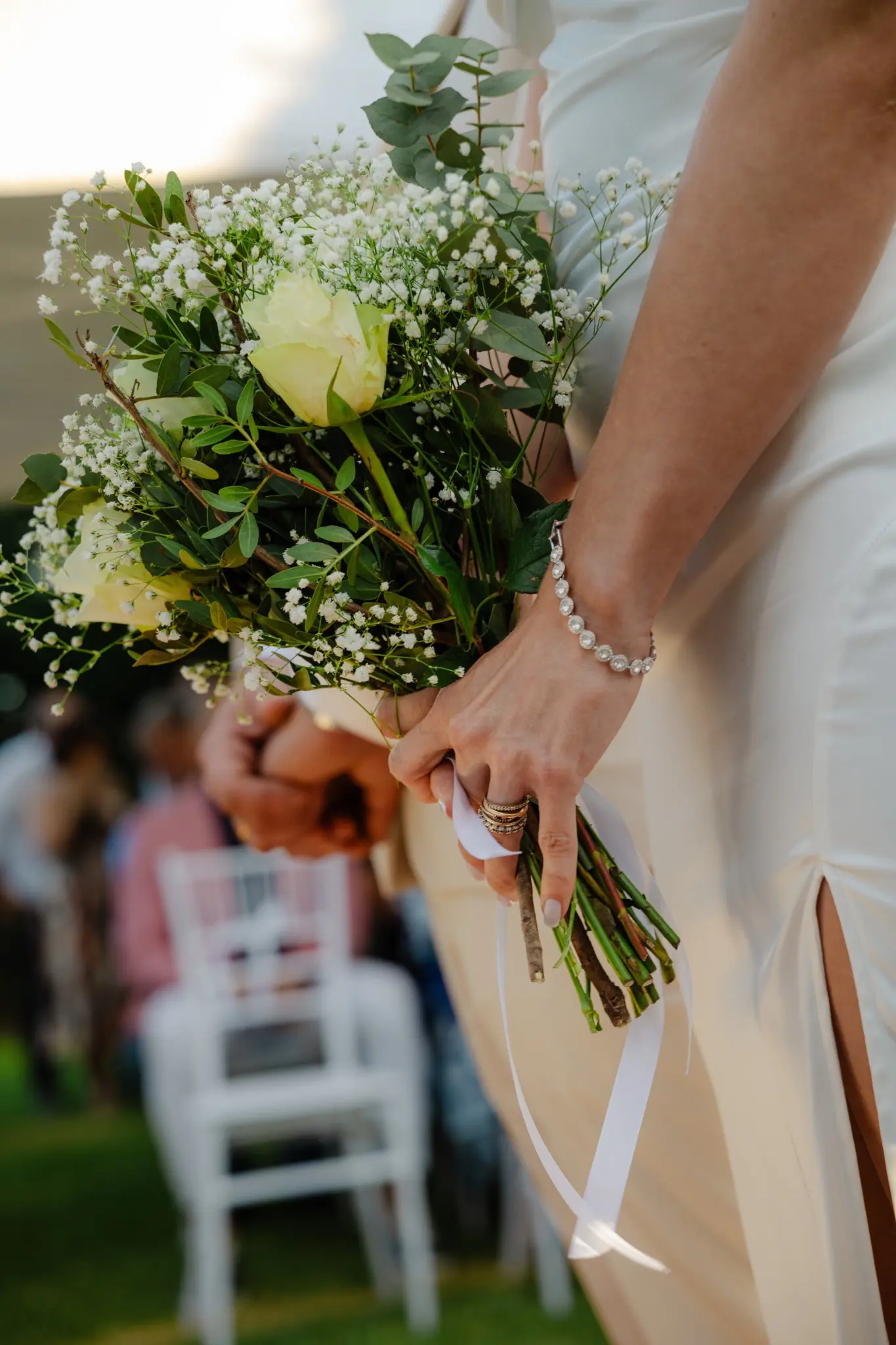 Hands holding the bridal bouquet