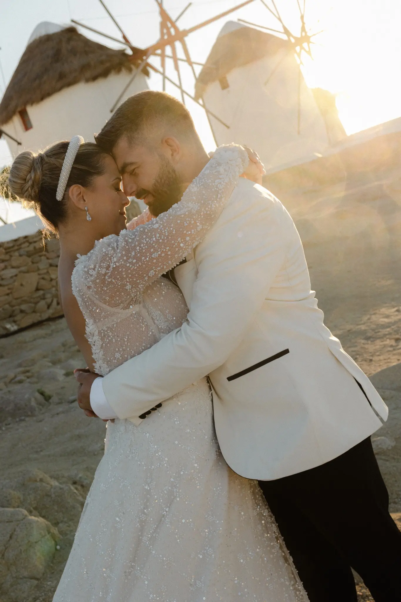 Couple embracing in warm evening sunlight