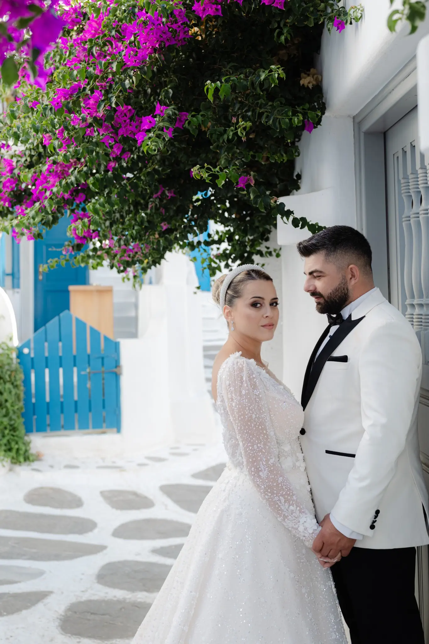 Newlyweds beneath the bougainvillea in Mykonos