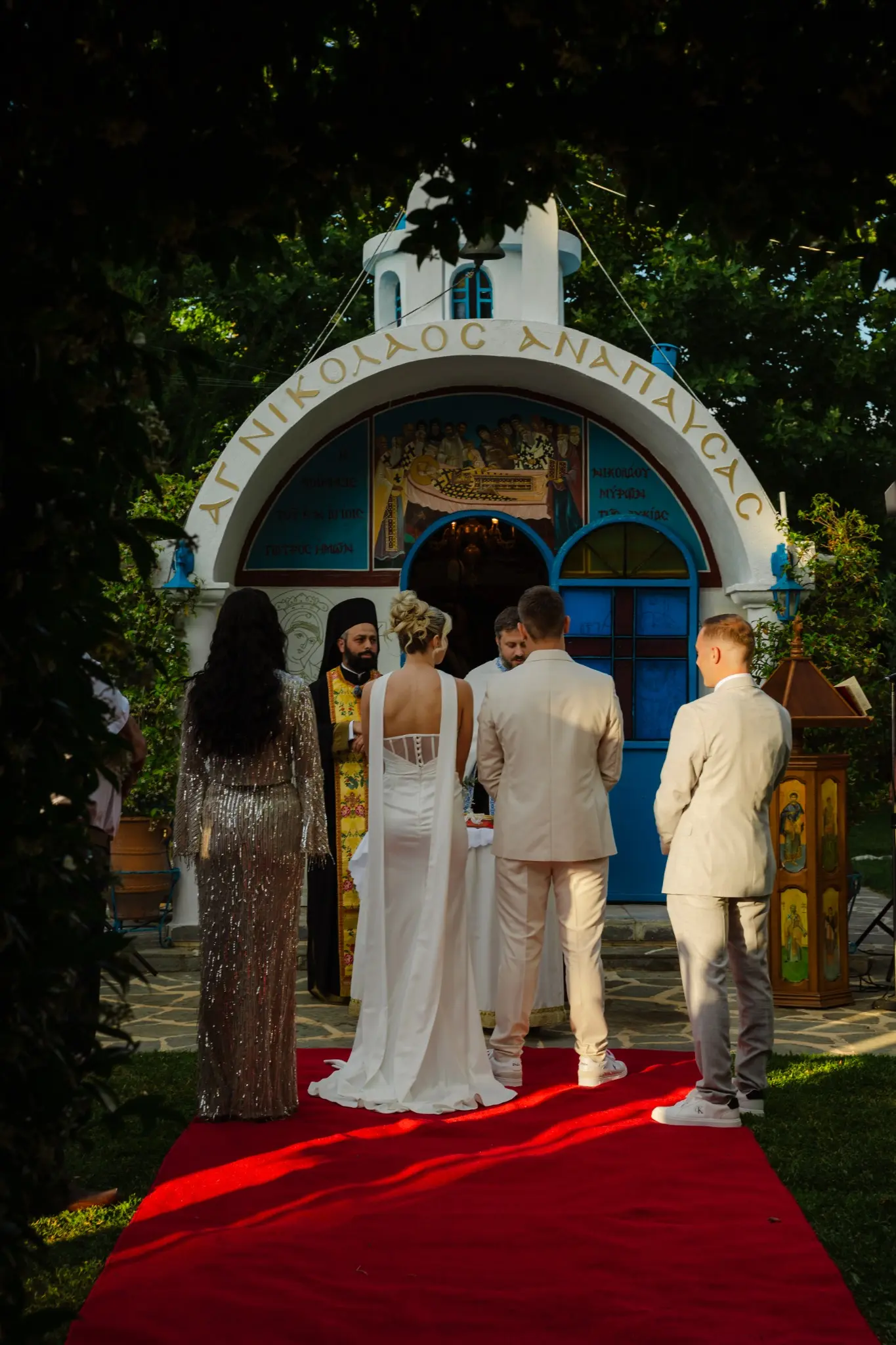 Wedding ceremony with guests gathered around a small chapel