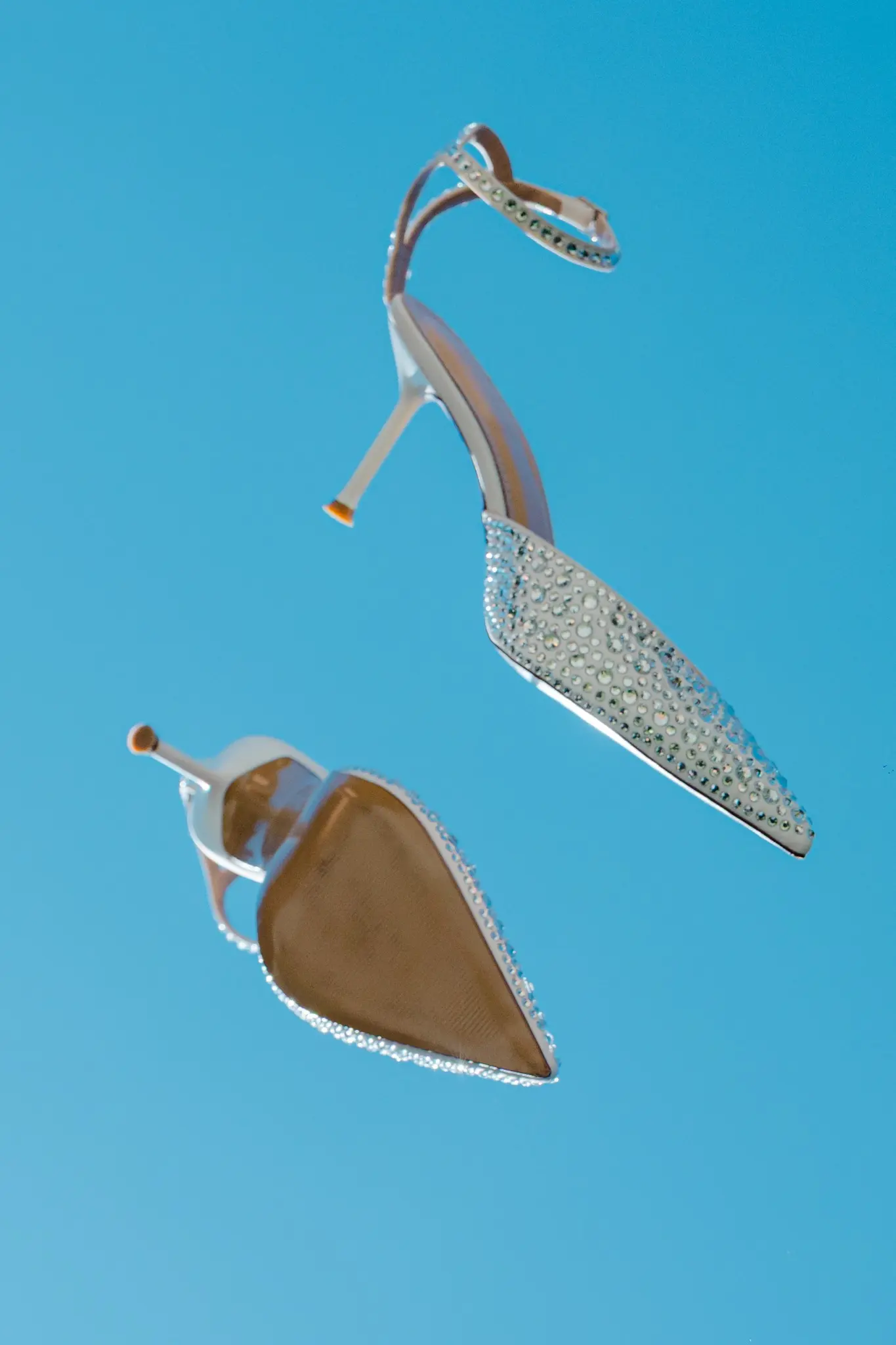 Bridal shoes against a bright blue sky