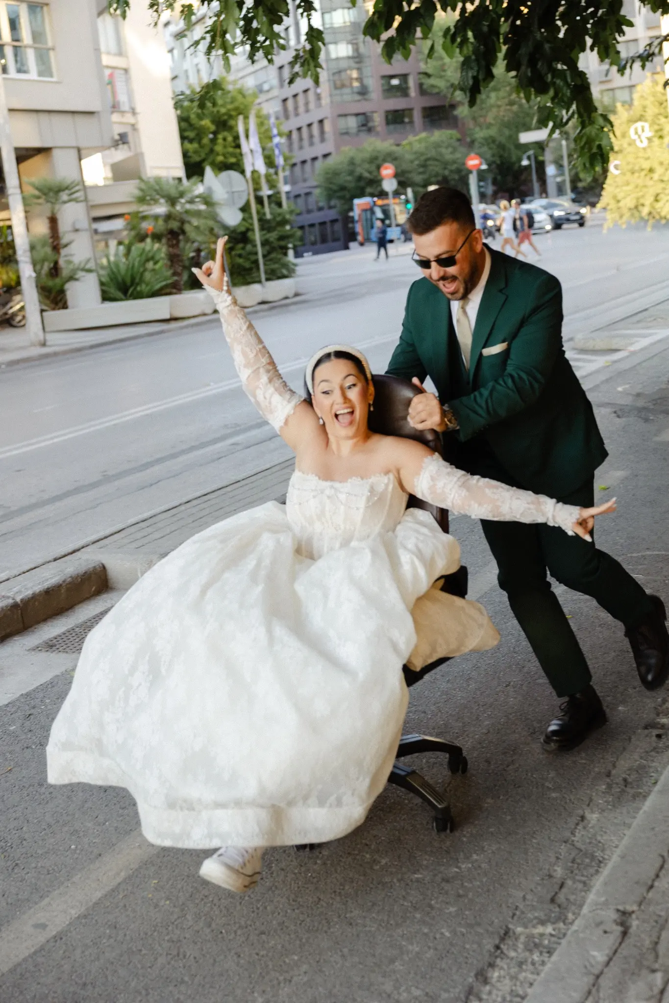 Couple moving together through a street in a playful moment